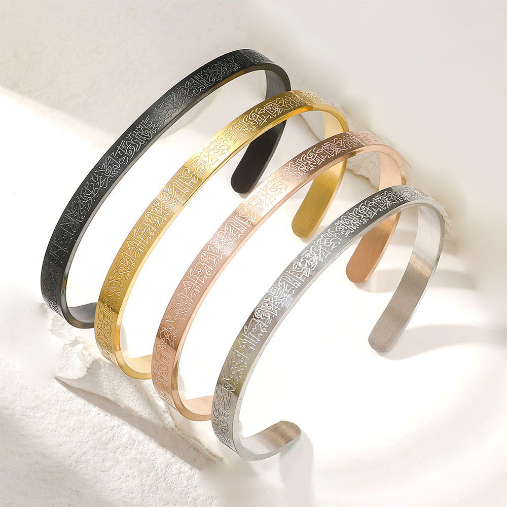 CIGAONI cuff bracelets in gold, silver, rose gold and black flat lay on white background