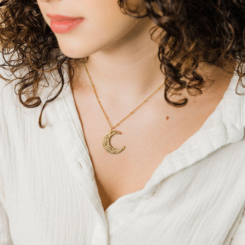 Elegant model wearing CIGAONI gold Ayatul Kursi crescent pendant - Minimalist faith inspired jewelry for daily wear