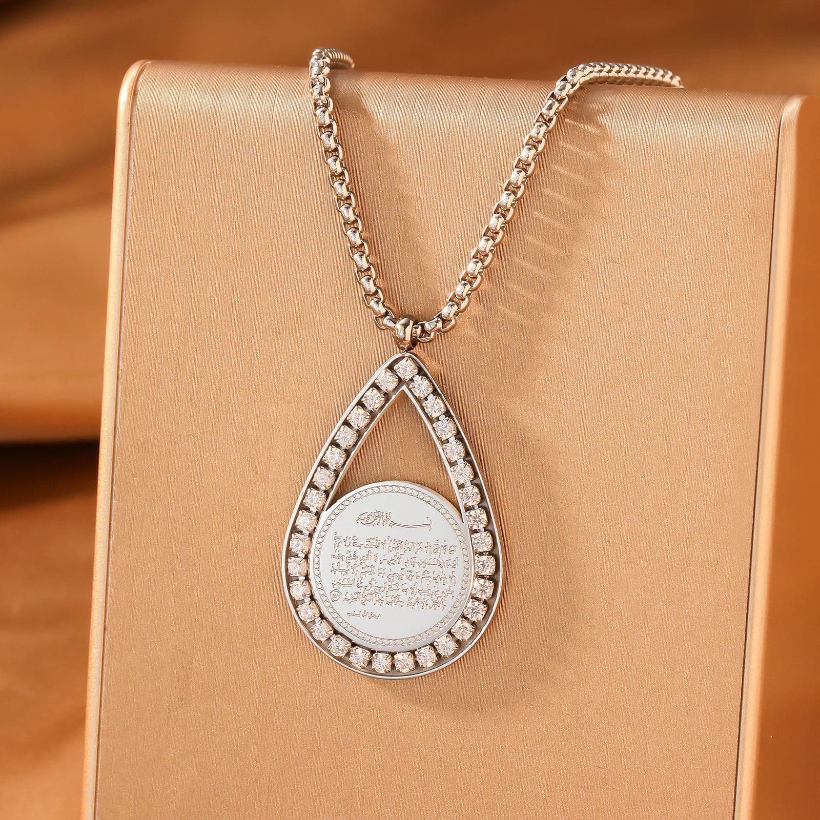 CIGAONI teardrop pendant necklace in silver finish with white stone center, minimalist luxury design