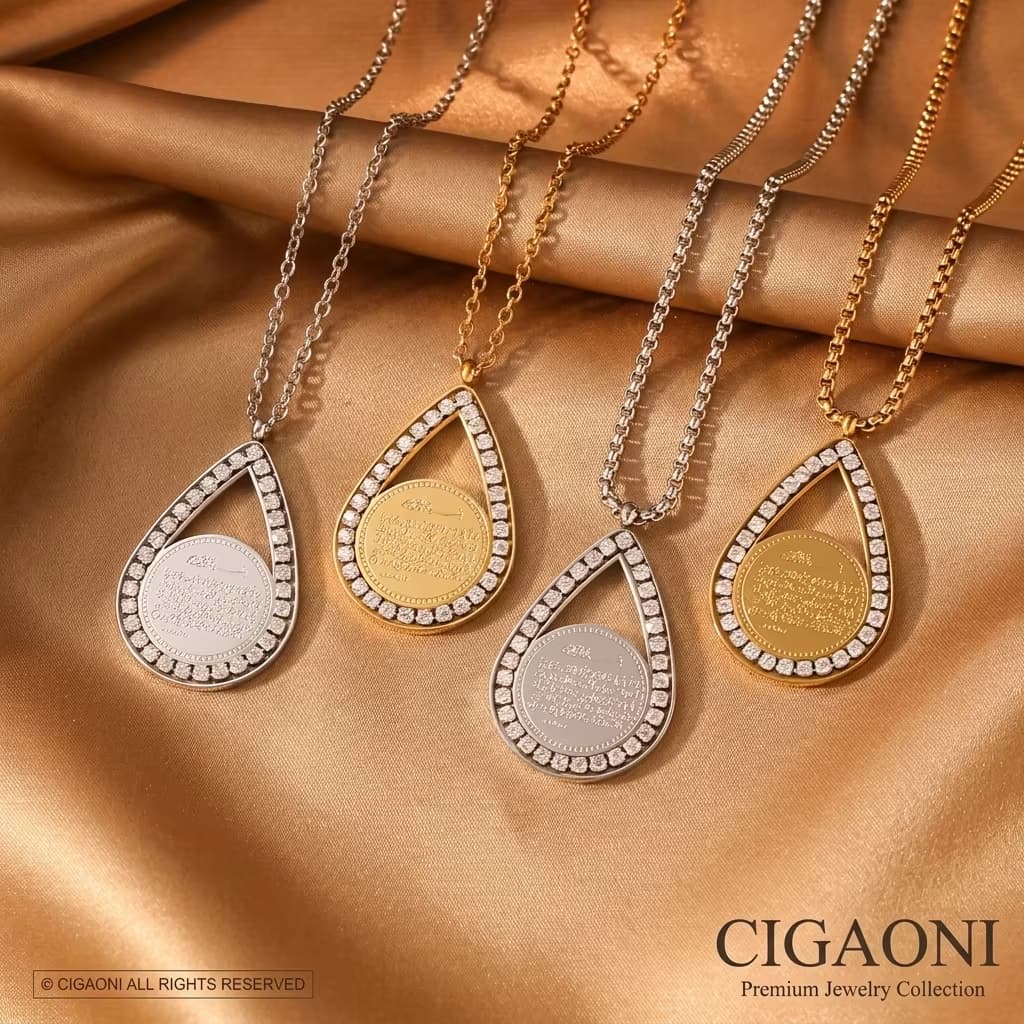 CIGAONI luxury teardrop pendant necklace set in gold, silver, and rose gold with mother-of-pearl stone displayed on golden silk fabric