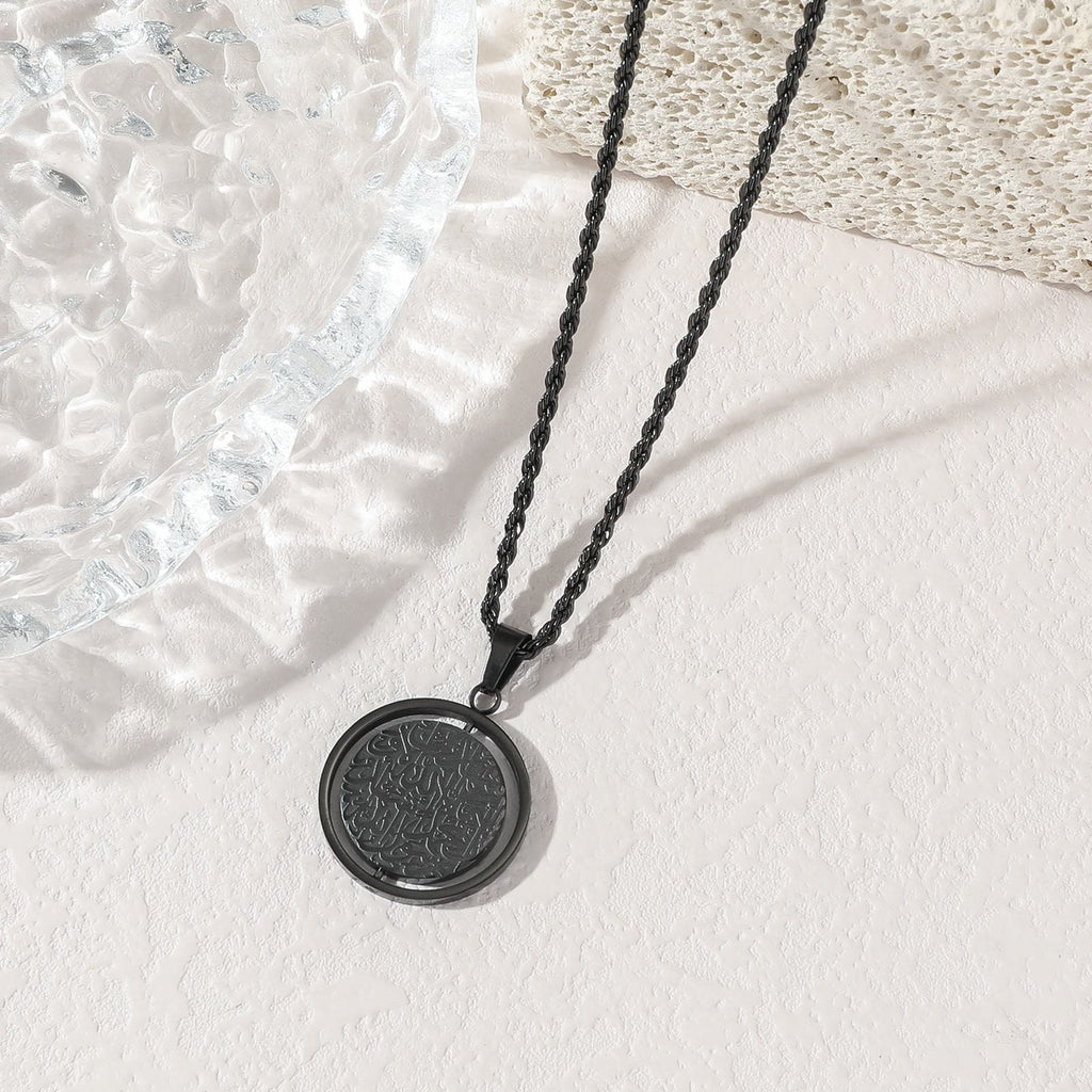 Midnight Black Ayatul Kursi Spinner Pendant - Unique matte black finish Islamic jewelry with sharp laser-etched script and rope chain


