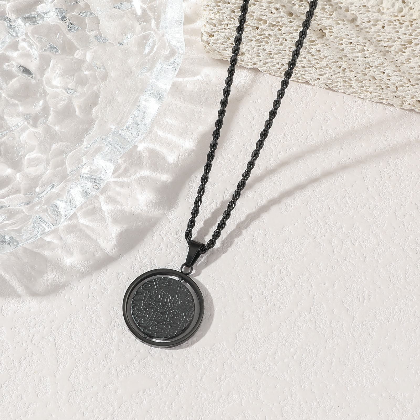 Midnight Black Ayatul Kursi Spinner Pendant - Unique matte black finish Islamic jewelry with sharp laser-etched script and rope chain

