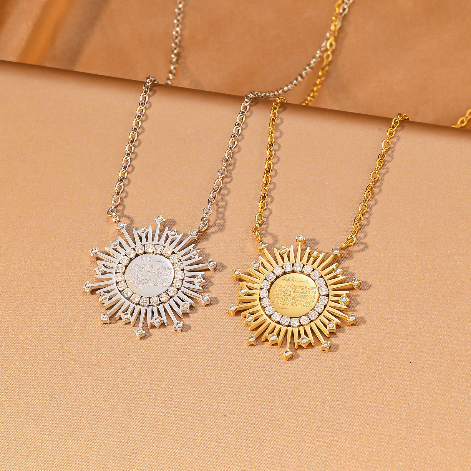 CIGAONI Ayatul Kursi sunburst necklace in gold and silver showing Arabic calligraphy engraving detail