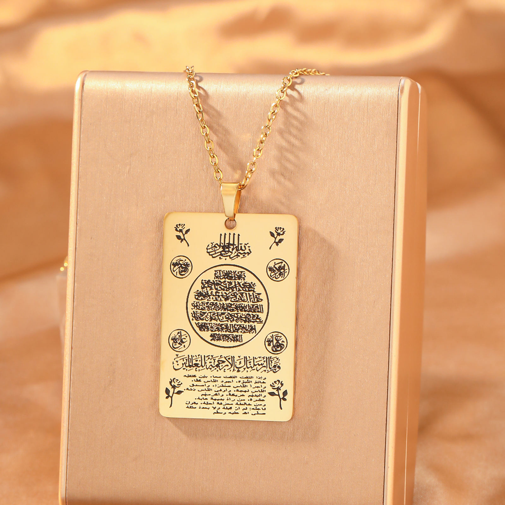 CIGAONI 18K gold Heritage Tablet full Ayatul Kursi plaque necklace with floral motifs on gold jewelry display stand