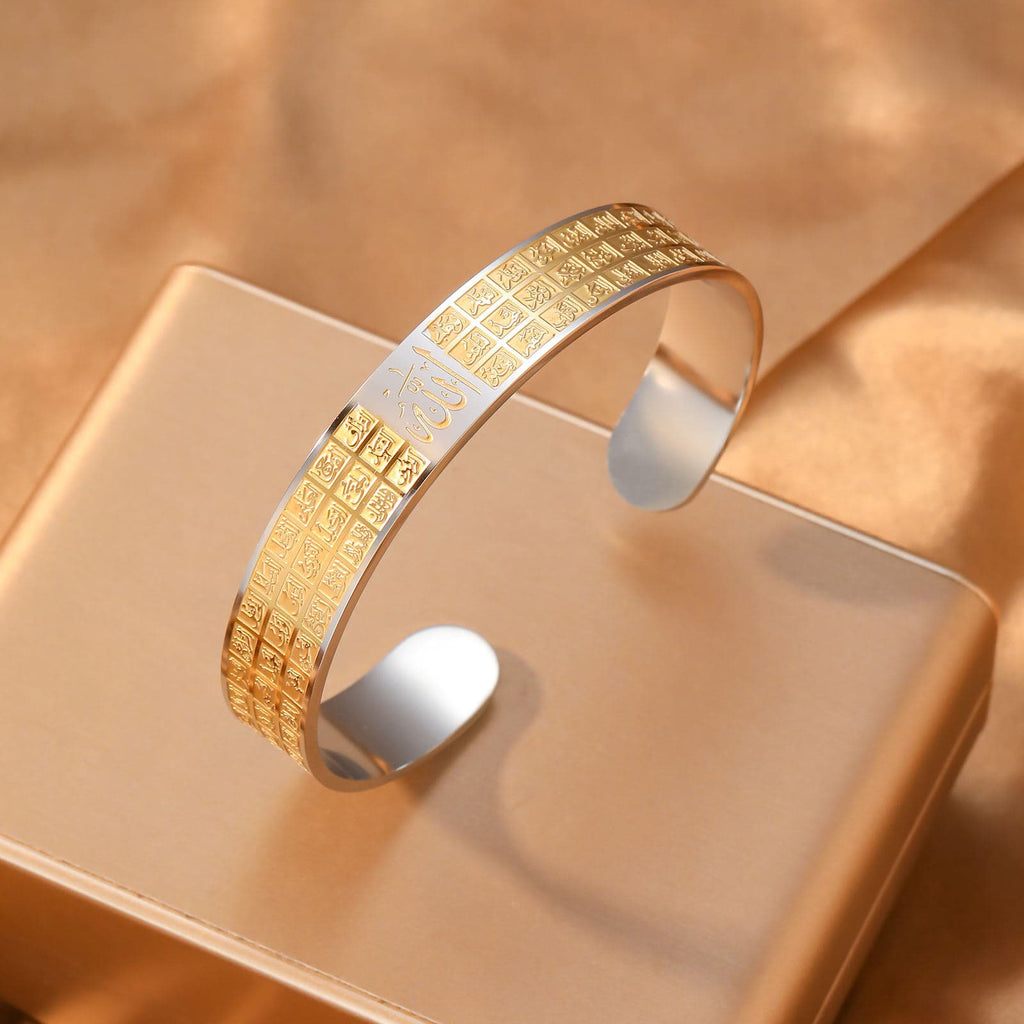 CIGAONI silver-gold two-tone Asma-ul-Husna open cuff bangle with 99 Names of Allah engraving on display stand