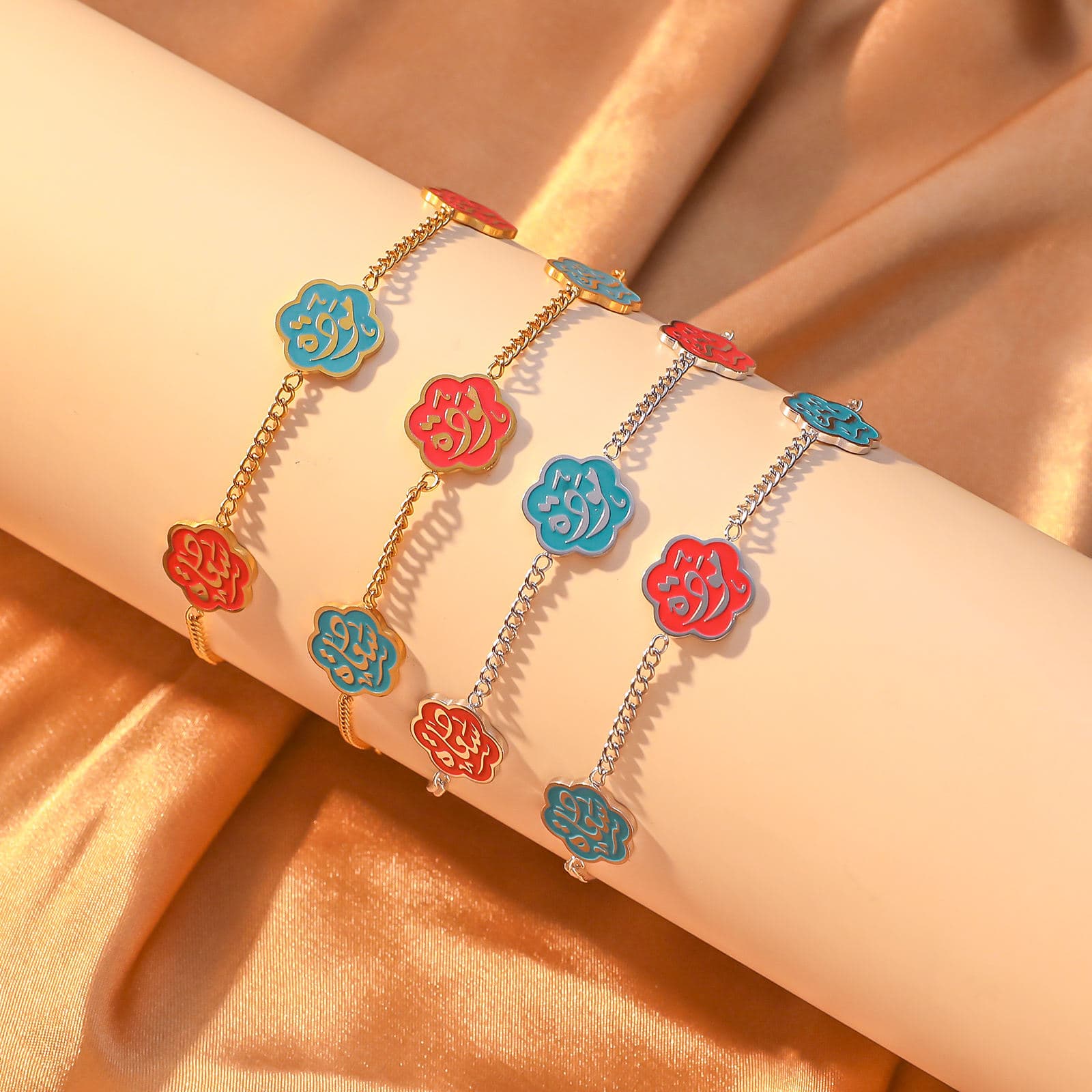 CIGAONI Floral Faith Bracelet – Four variants in gold and silver chain with red and blue enamel Arabic calligraphy flower charms

