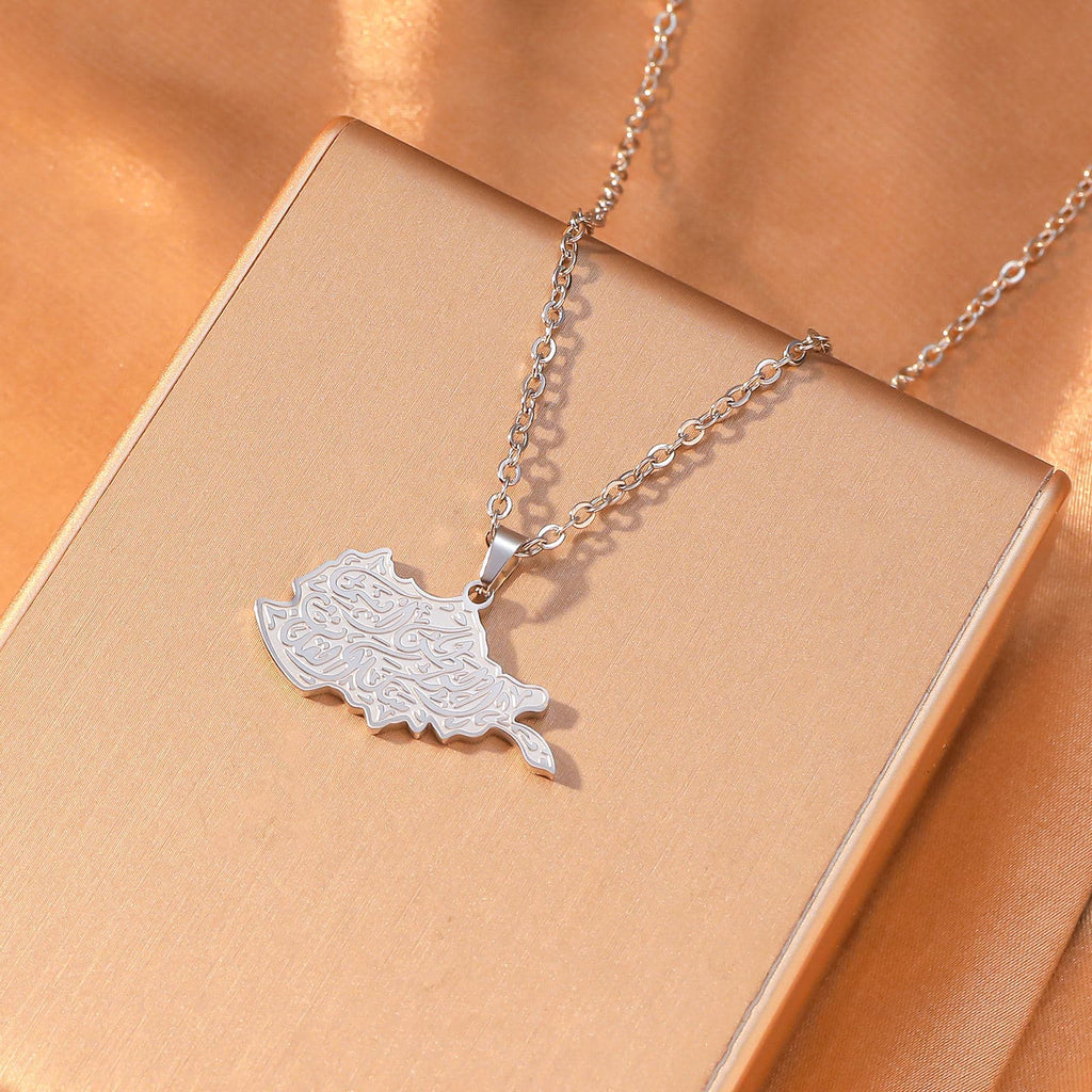 CIGAONI Sacred Soil Silver Iraq Map Necklace - Arabic Calligraphy Heritage Jewelry Flat Lay