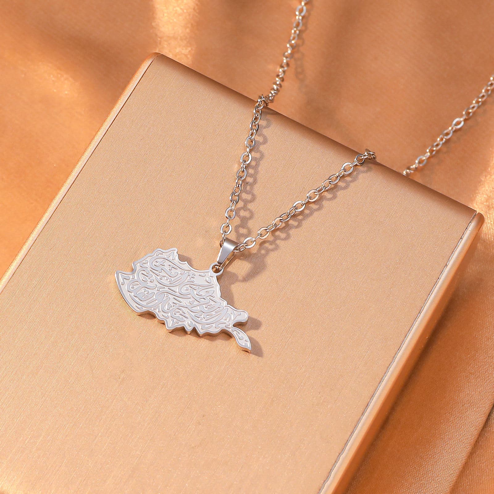 CIGAONI Sacred Soil Silver Iraq Map Necklace - Arabic Calligraphy Heritage Jewelry Flat Lay