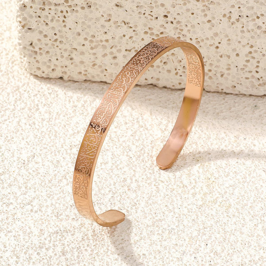 CIGAONI Pure Sanctuary Ayatul Kursi rose gold open cuff bangle with Arabic calligraphy engraving on stone surface


