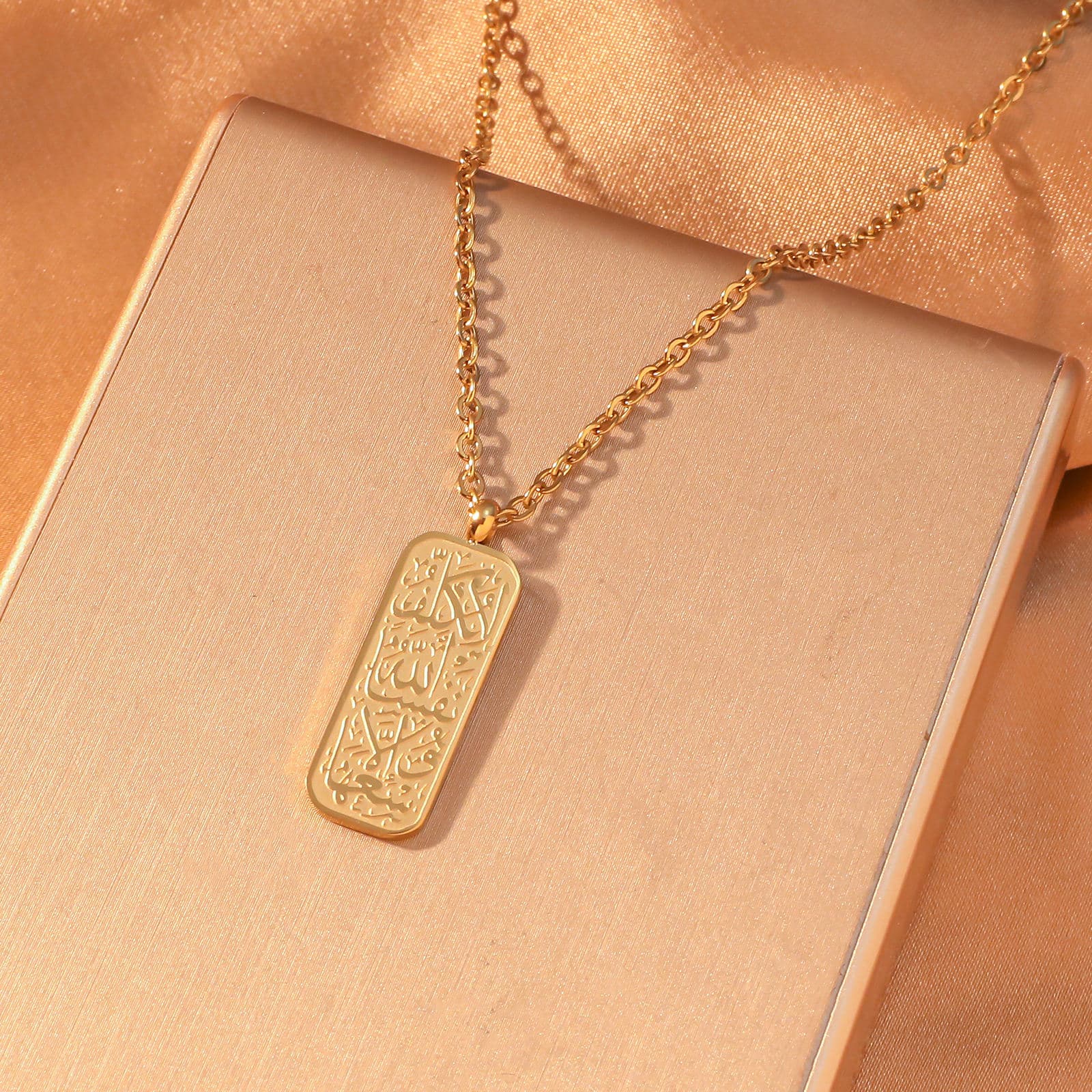 CIGAONI 18K Gold Allah Arabic Calligraphy Rectangular Plaque Necklace on gold satin gift box with rolo chain detail
