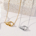 Ayatul Kursi Double Interlocking Ring Necklace in Gold and Silver - Flat Lay Product Shot | CIGAONI

