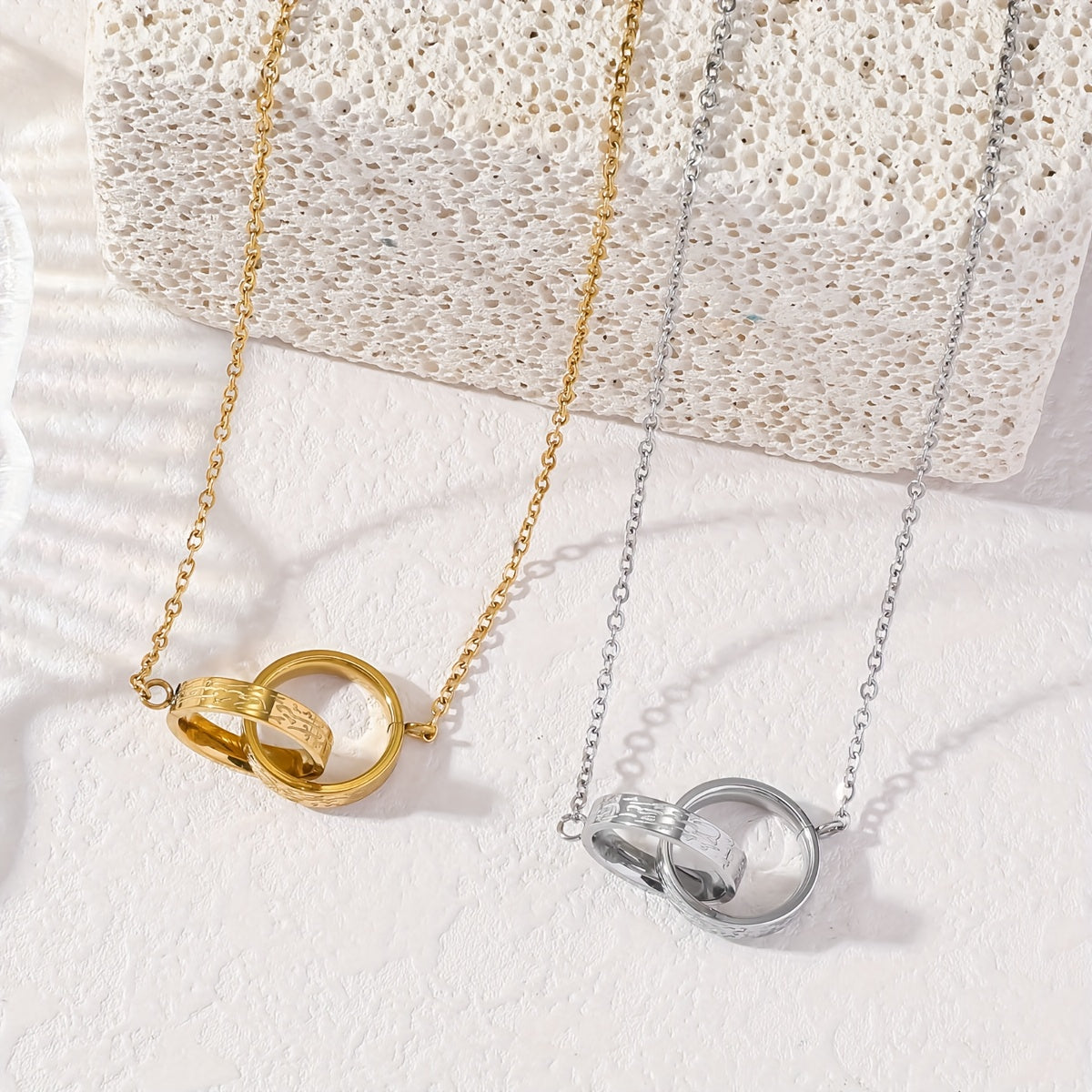 Ayatul Kursi Double Interlocking Ring Necklace in Gold and Silver - Flat Lay Product Shot | CIGAONI

