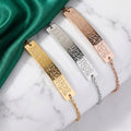 CIGAONI Ayatul Kursi Bar Bracelet in gold, silver and rose gold, engraved with Arabic calligraphy, displayed on marble with green satin