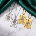 CIGAONI Heritage Tablet full Ayatul Kursi plaque necklaces in silver and gold with floral motifs displayed on white marble with green silk backdrop