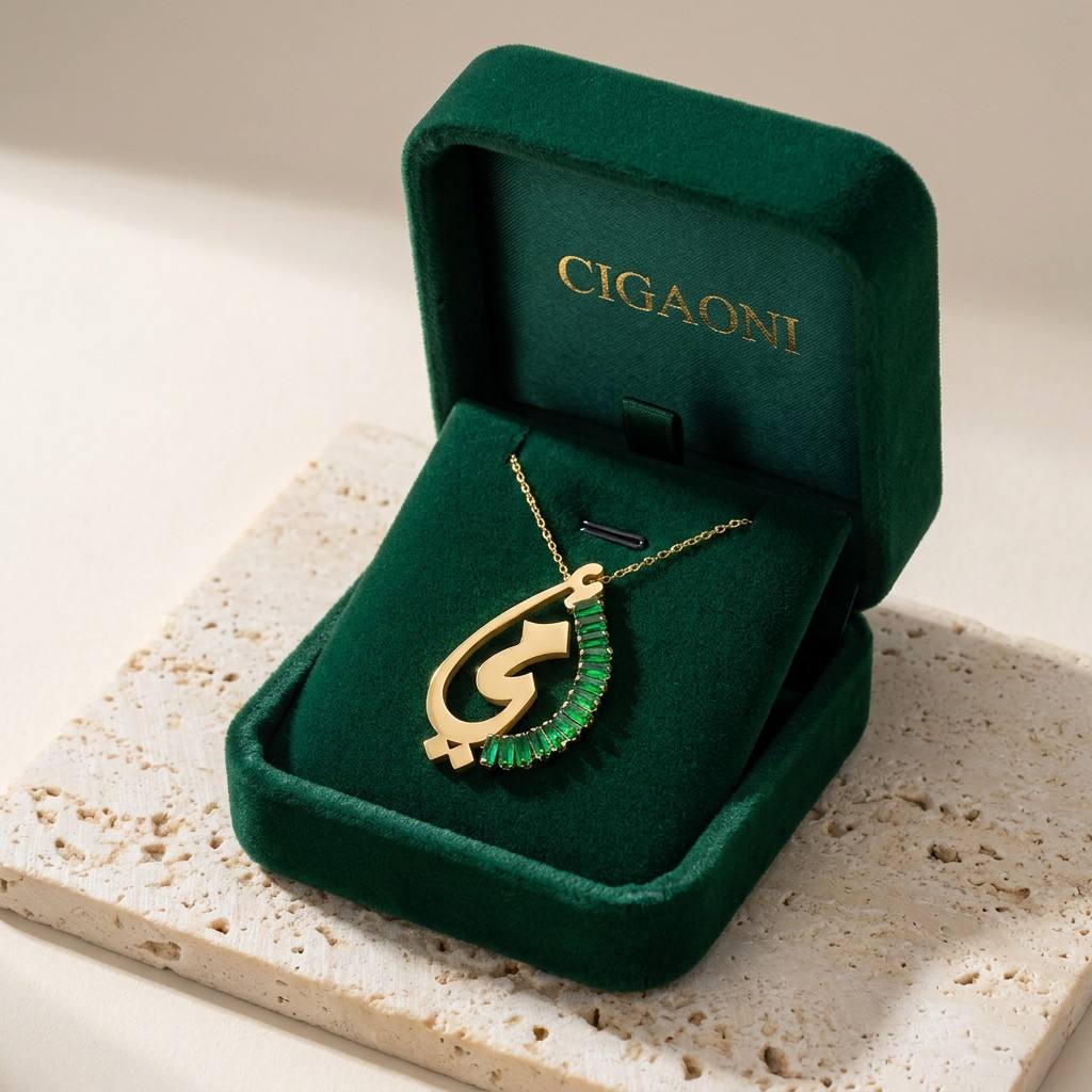 Gold faith-inspired Arabic pendant necklace displayed in luxury green velvet gift box