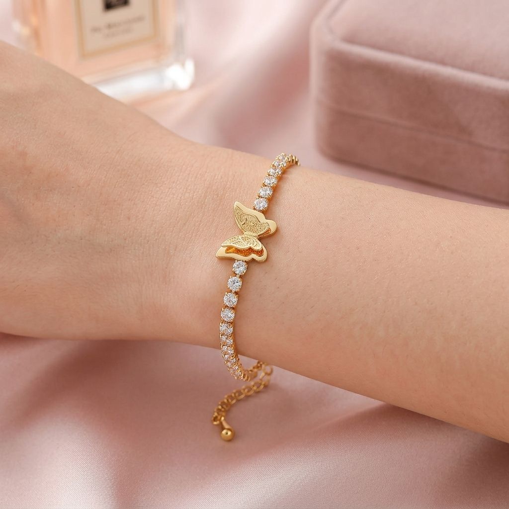 Elegant model wearing CIGAONI gold butterfly tennis bracelet - Sparkling AAA zirconia faith inspired jewelry for women