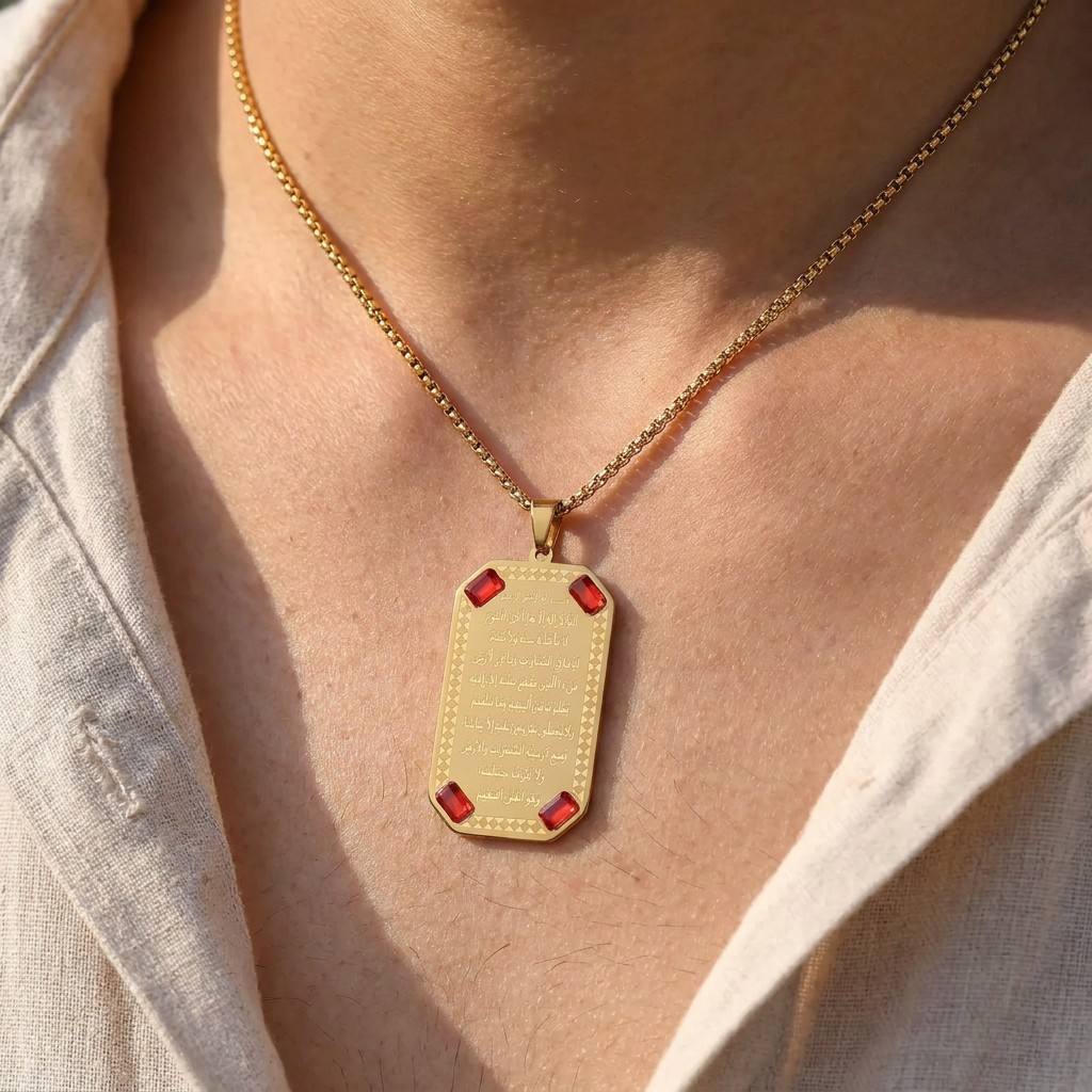Man wearing CIGAONI Ayatul Kursi 18K gold plaque necklace with red crystal corners – Islamic spiritual jewelry