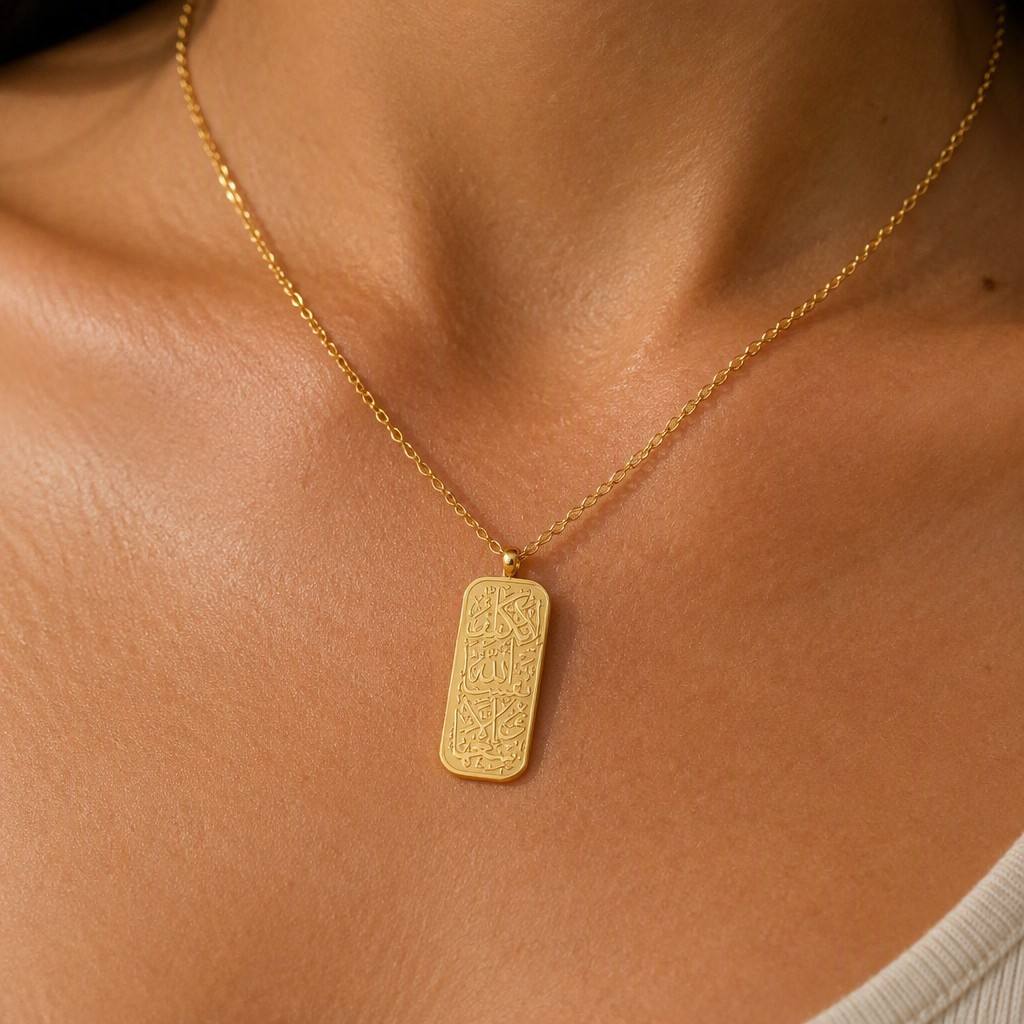 Woman wearing CIGAONI 18K Gold Allah Arabic Calligraphy Plaque Necklace on neck - close up lifestyle shot showing pendant detail