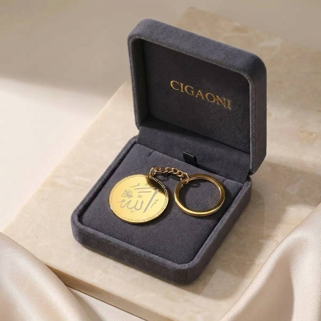 Luxury unboxing of CIGAONI gold Allah keychain - Premium branded velvet gift box with sacred religious keyring

