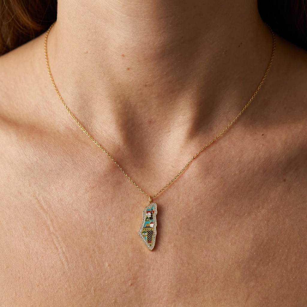 Close-up of delicate enamel pendant necklace worn on neck - CIGAONI