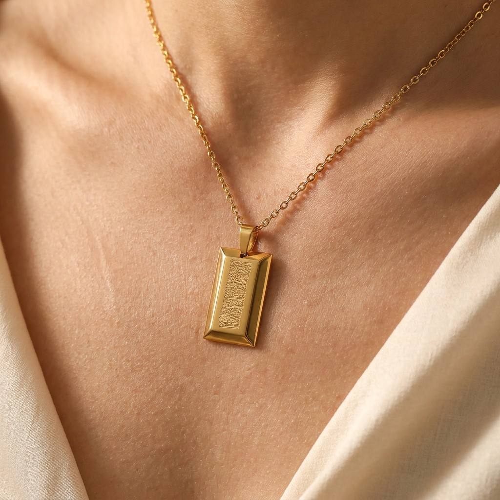 Elegant female model with dainty gold sacred tablet necklace - Sophisticated and minimalist Islamic jewelry for women

