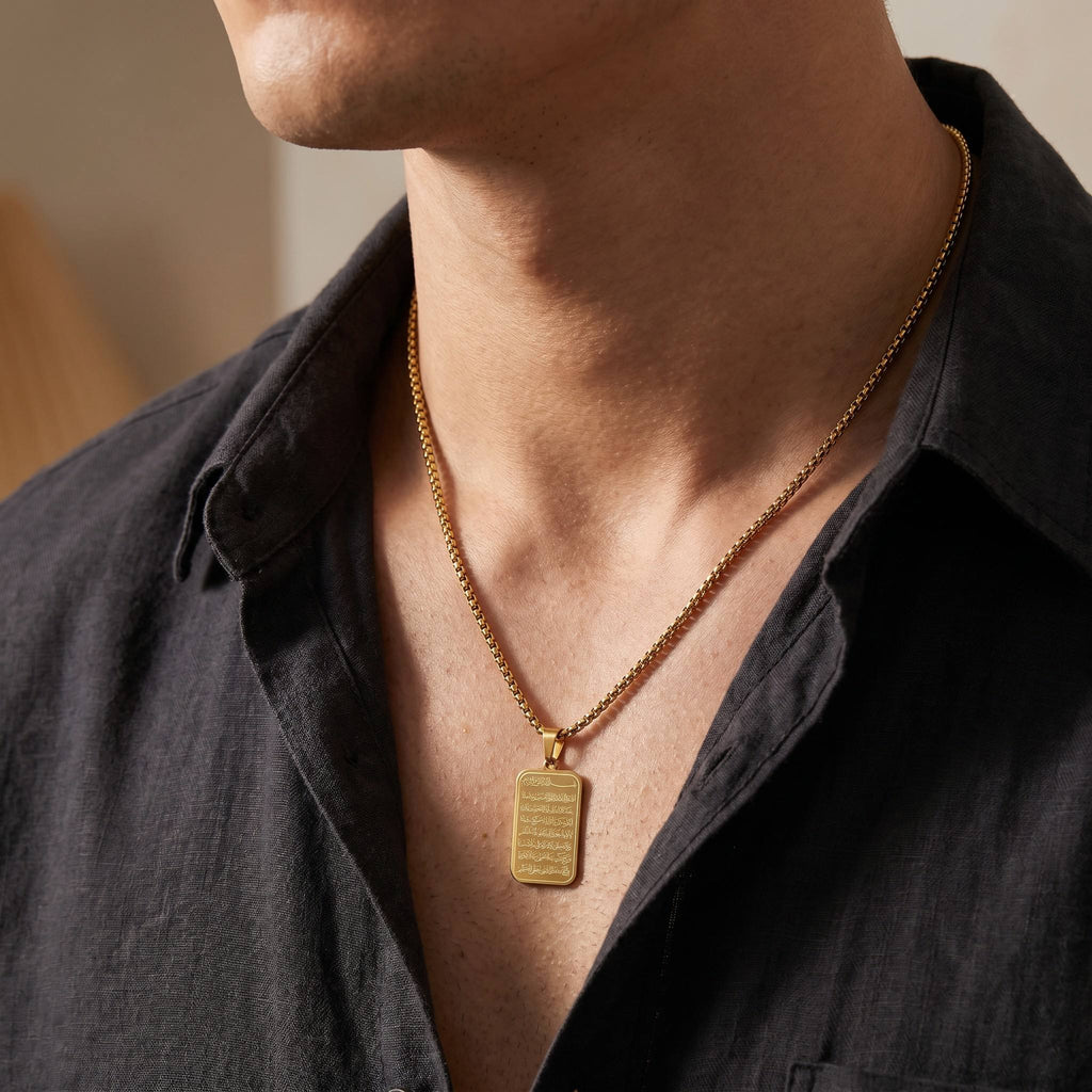 Man wearing CIGAONI 18K gold Ayatul Kursi plaque necklace with box chain on dark shirt