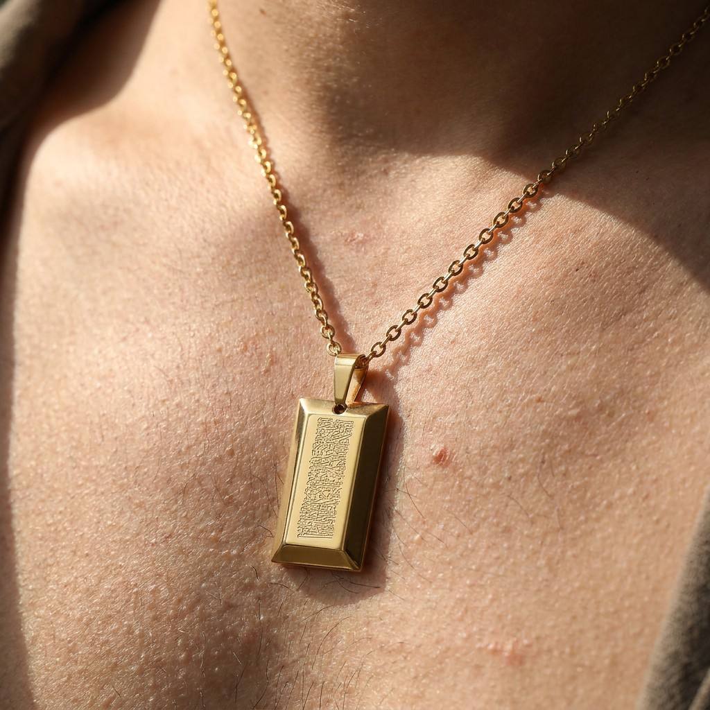 Professional male model wearing CIGAONI gold Ayatul Kursi pendant - Masculine and authoritative faith inspired jewelry for men

