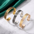 CIGAONI Asma-ul-Husna open cuff bangle in gold, silver-black and rose gold variants with 99 Names of Allah engraving on marble surface