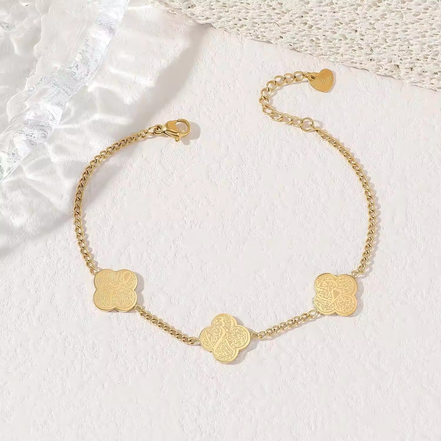 CIGAONI gold four-leaf clover bracelet with Arabic calligraphy engraving on white background — Islamic jewelry gift

