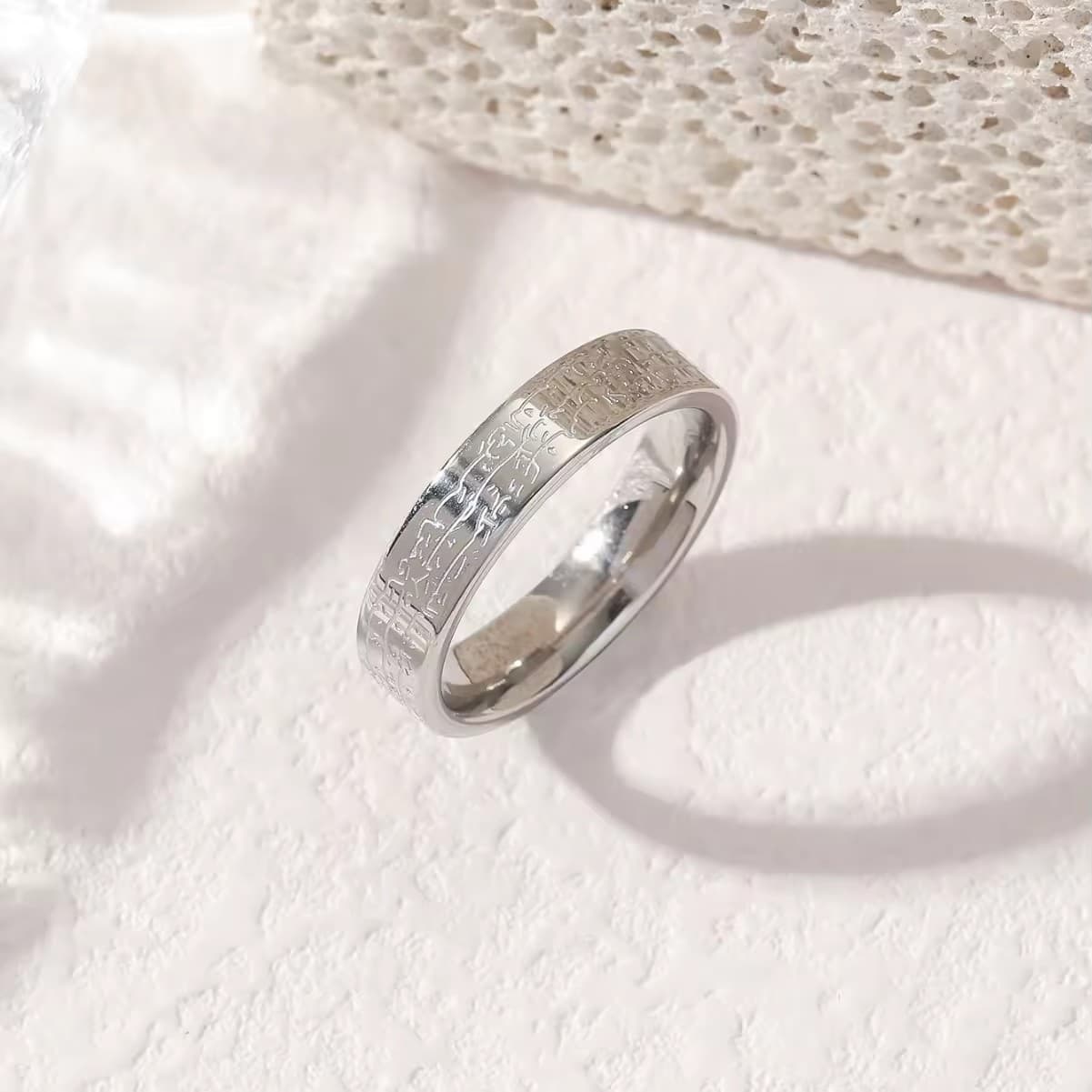 CIGAONI Eternal Verse polished silver Arabic calligraphy band ring – close-up showing 360-degree sacred text engraving on neutral background

