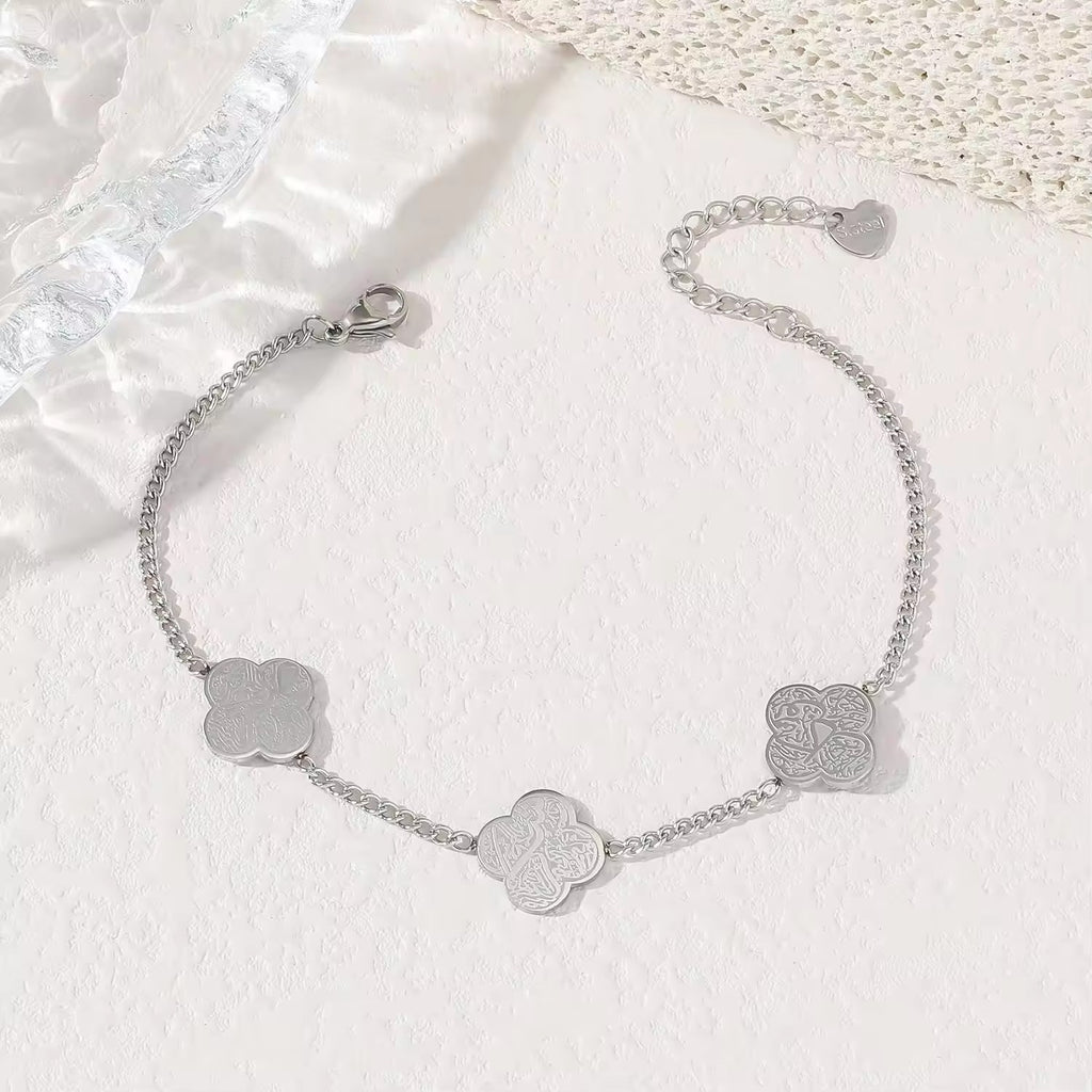 CIGAONI silver four-leaf clover bracelet with Arabic calligraphy engraving on white background — Islamic jewelry gift

