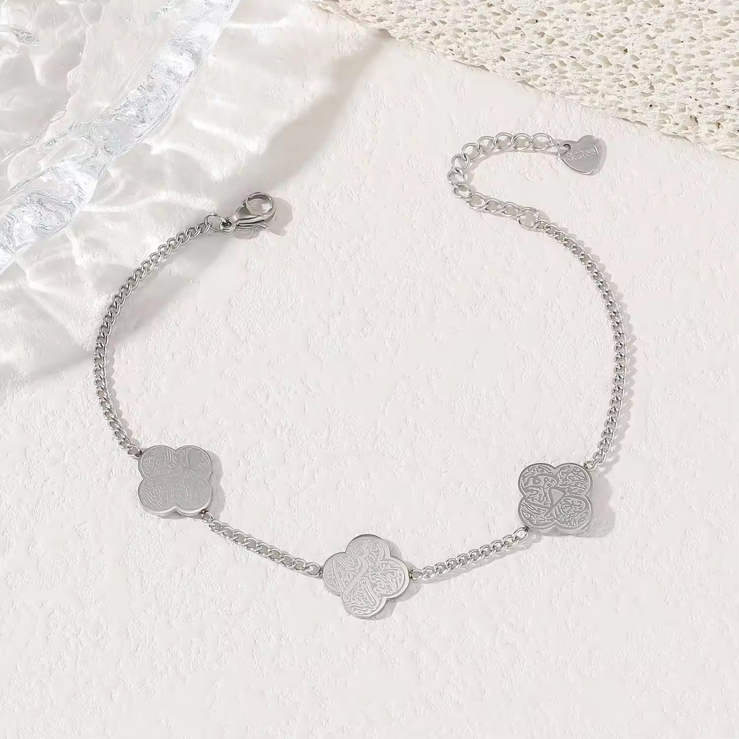 CIGAONI silver four-leaf clover bracelet with Arabic calligraphy engraving on white background — Islamic jewelry gift

