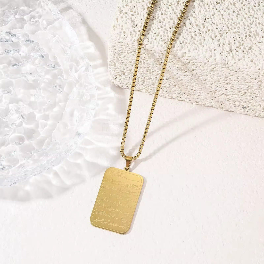 CIGAONI 18K gold Ayatul Kursi plaque necklace with box chain on white textured background
