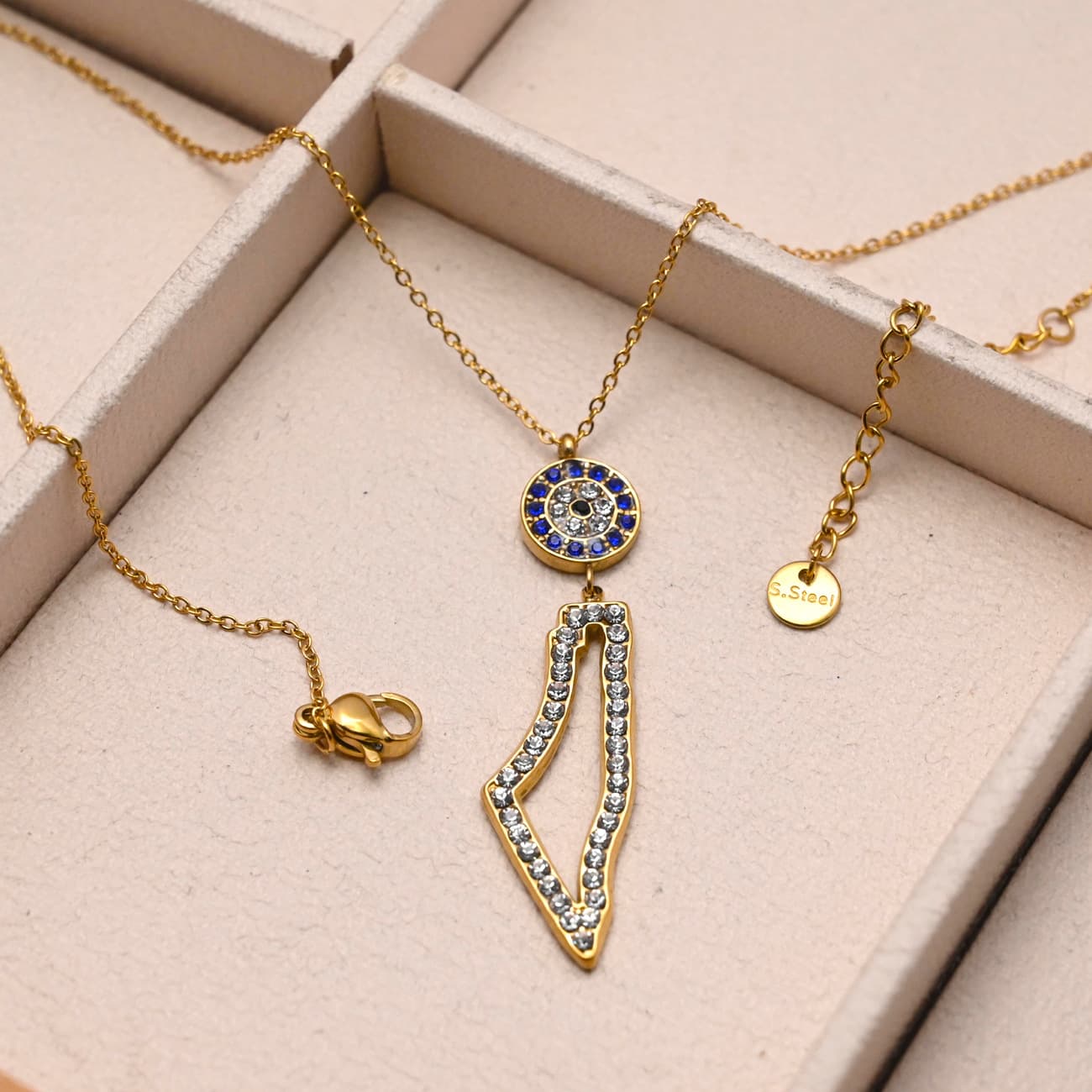 Eternal Guardian Necklace gold geometric pendant and heart charm necklace flat lay styling - CIGAONI