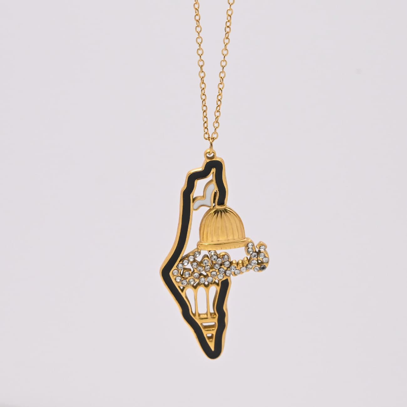 Palestine map outline gold pendant necklace on textured background - CIGAONI
