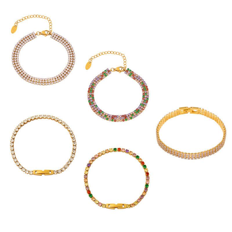 CIGAONI tennis bracelets flat lay on white background — single row clear, multicolor, double row and clover designs

