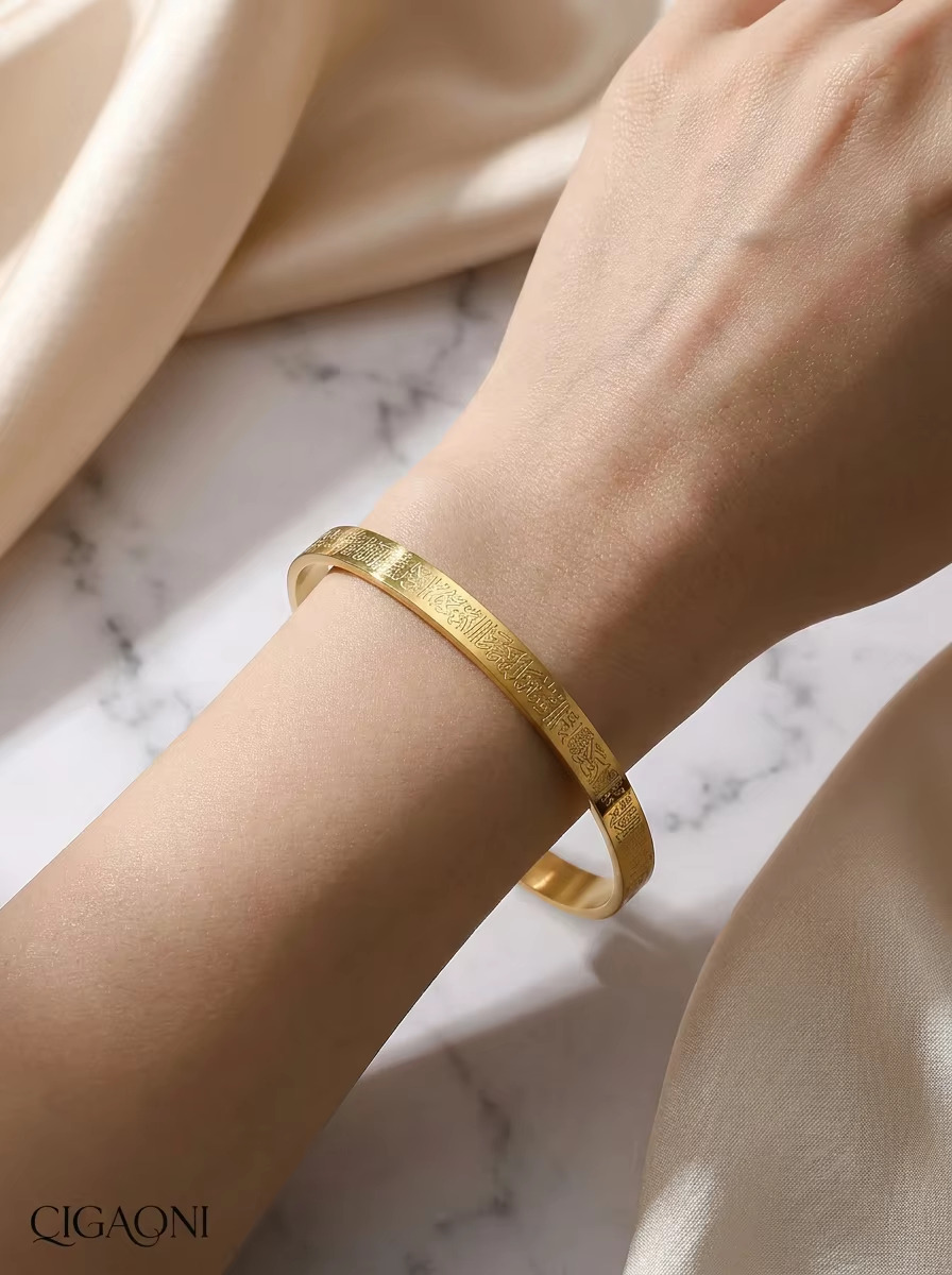 Model wearing CIGAONI gold cuff bracelet on wrist
